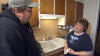 Michael Moore talks with fellow Flint, MI native Lila Lipscomb, mother of a serviceman stationed in Iraq, in Lions Gate Films' Fahrenheit 9/11