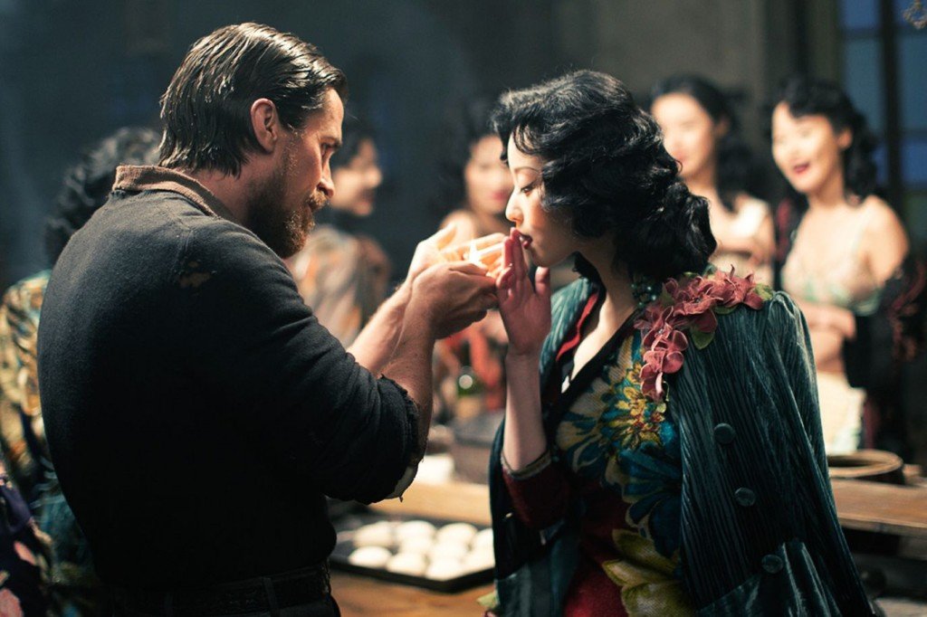 Christian Bale and Ni Ni star in THE FLOWERS OF WAR. Christian Bale and Ni Ni star in THE FLOWERS OF WAR.